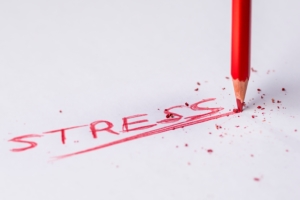Stress written in red pencil on white paper | stress relief